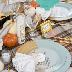 A Festive Table Setting Ready For Thanksgiving Dinner