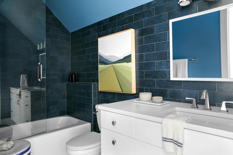 Landscape Art Stands Out on Blue Subway-Tiled Bathroom Wall