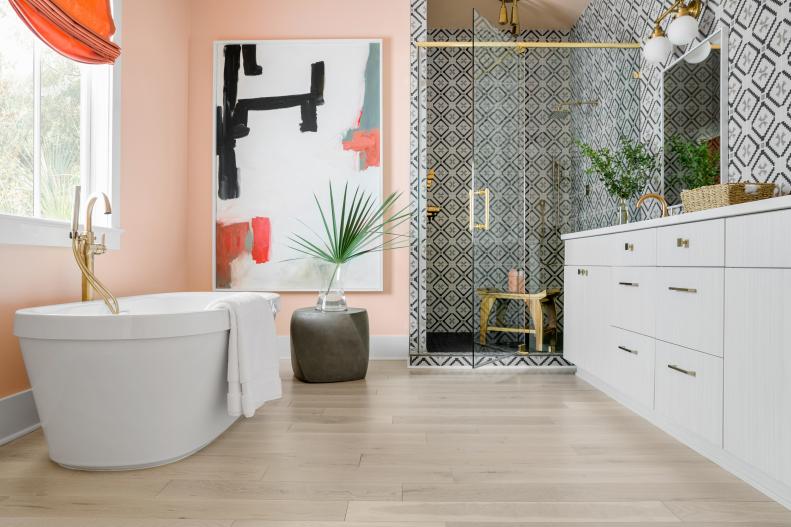 Pink Master Bathroom With Light Hardwood Floor