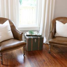 Cozy Sitting Nook Has Leather Chairs and Trunk Side Table