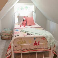 Kid's Bed Tucked in Attic Bedroom Alcove