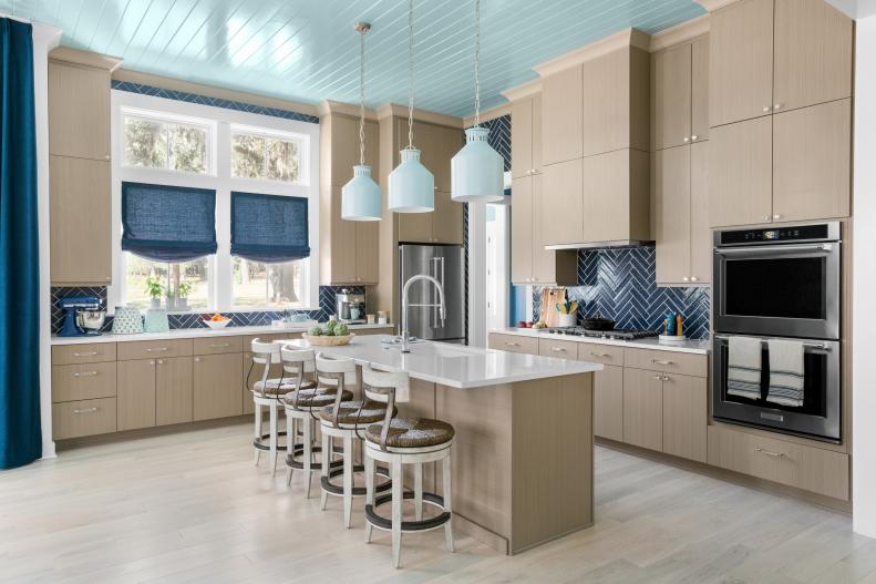Blue Coastal Kitchen With Light Wood Cabinets and Painted Wood Ceiling