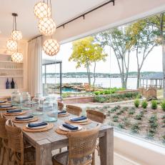 Coastal Dining Room With Floor-To-Ceiling Windows