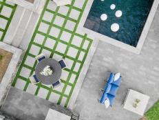Concrete-Paver-and-Grass Poolside Patio in Striking Grid-Like Pattern