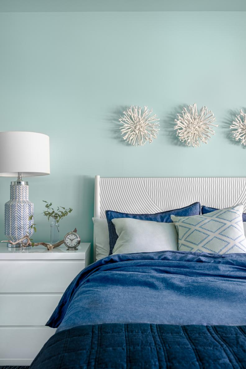 Blue and White Decor Complements Pale Blue Walls in Coastal Bedroom