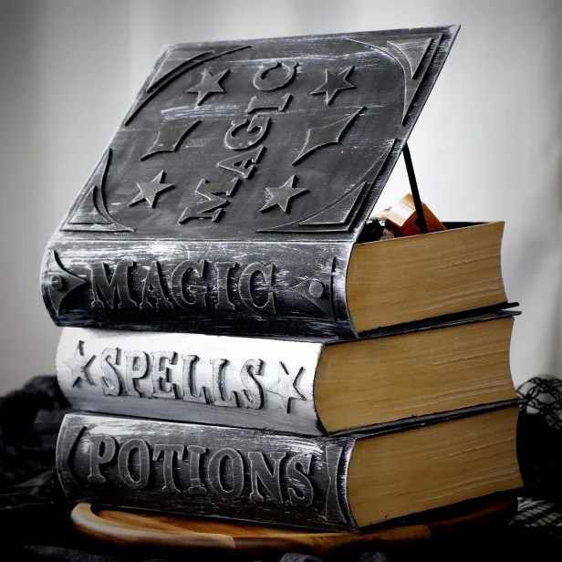 Stack of Crafted Magic Books Made Into a Halloween Candy Bowl