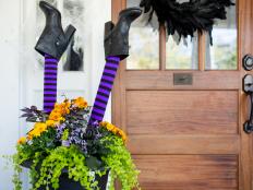 Craft your own spooky porch planter with a pool noodle and stockings to create this wicked witch.