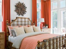 White Coastal-Style Master Bedroom With Coral-Colored Accents