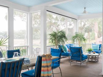 Multiple Sitting Areas Make Screened-In Porch a Great Gathering Spot