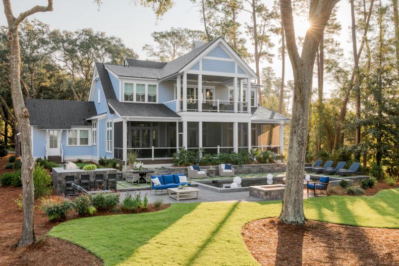Blue Coastal House With Screened-In Porch and Large Backyard