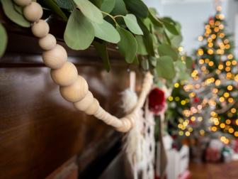 Close Up of Wooden Bead Garland Hanging From Mantel