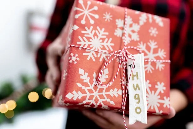 Woman Holding Present With Salt Dough Gift Tag