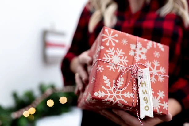 Woman Holding Present With Salt Dough Gift Tag