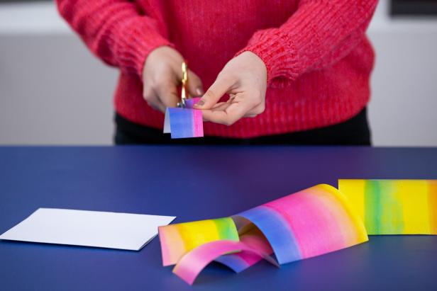 Cut small rectangles of various heights out of colorful wrapping paper.