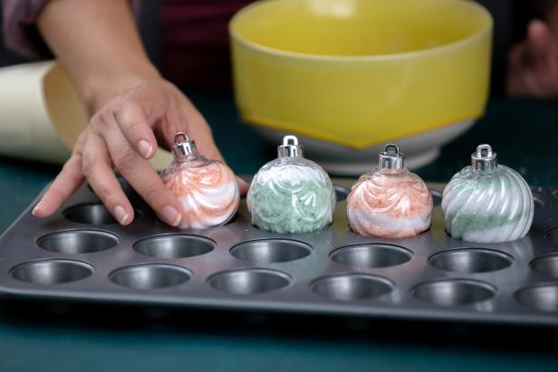 Need bulk gifts in a pinch? HGTV Handmade filled clear ornaments with a homespun bath salt mixture for holiday gift-giving. Here's a tip: fill the ornaments over a muffin tin to prevent them from sliding around. It makes this easy craft even easier!