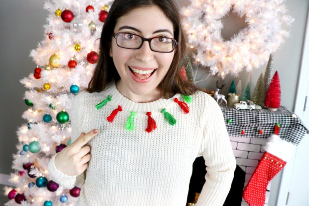 Woman Wearing Sweater With Tassels Around Collar 