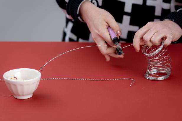 Begin by cutting a piece of string and a piece of wire to be the same length.