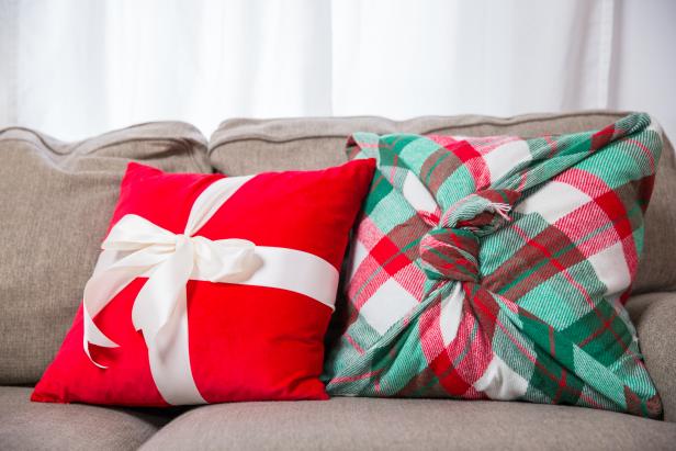Two Throw Pillows Decorated With Holiday Touches