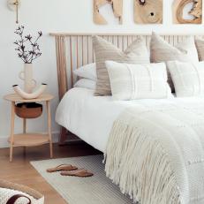 Neutral Scandinavian Master Bedroom With Wood Art
