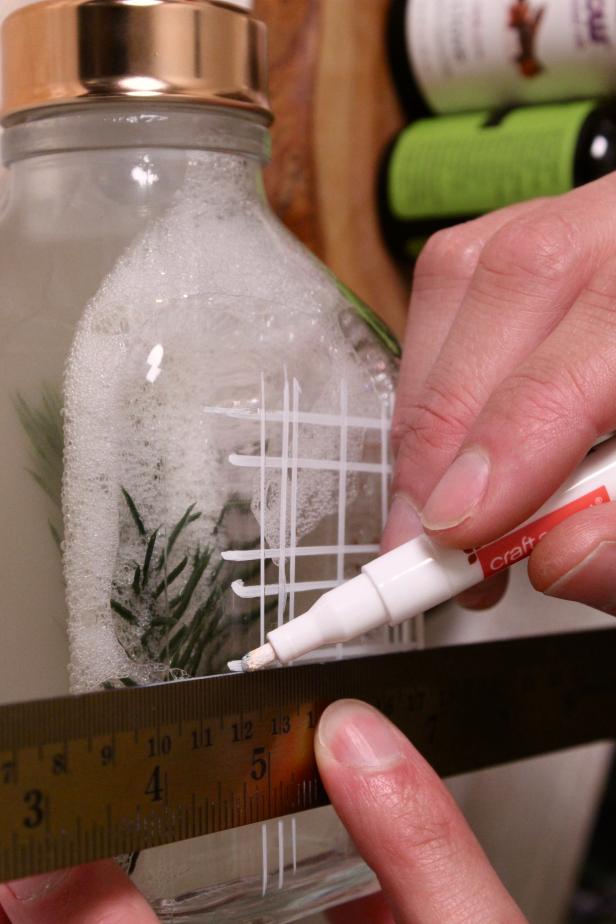 Add a fun design to your dispenser with a paint marker and ruler.