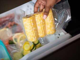 Placing vacuum sealed vegetables in freezer