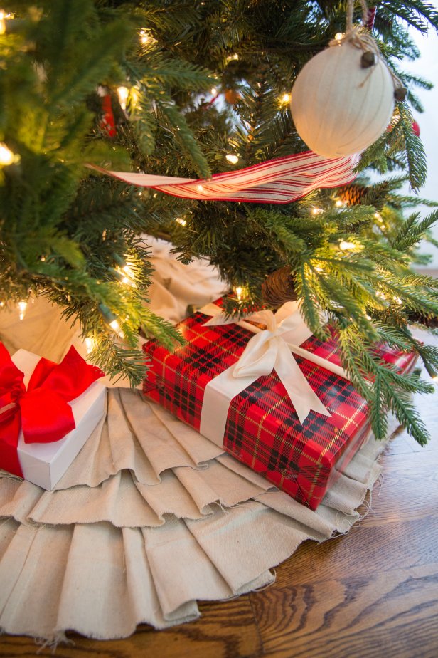 A Christmas Tree With a Pleated Skirt and Gifts