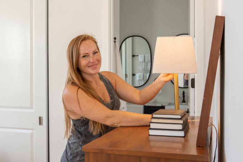 HGTV star Mina Starsiak puts her finishing touch in one of the bedrooms of the house that she must “rock” to the highest increase in market value through her renovation and design, as seen on Rock the Block. (Working)