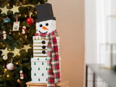 A Stack of Wrapped Presents That Looks Like A Snowman