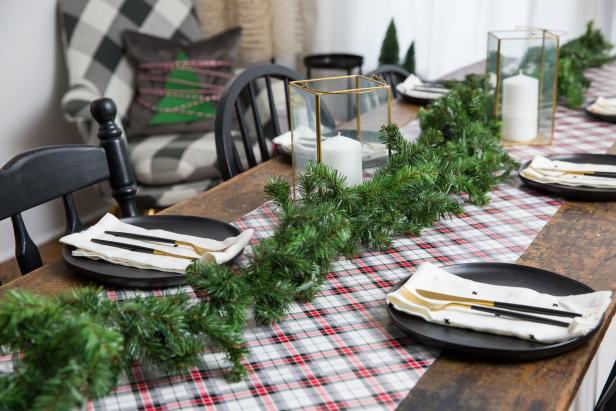 A Plaid Wrapping Paper Table Runner With Evergreen Garland