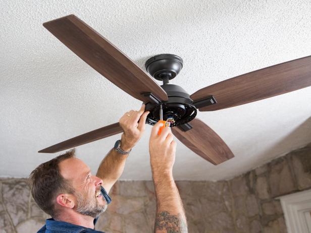 Next, you need to attach the fan blades. This can be a little tricky if it’s your first time installing a fan. The blades need to be held in the air while you screw them into place at the fan motor. If you need to, get help holding the blades while you attach them.