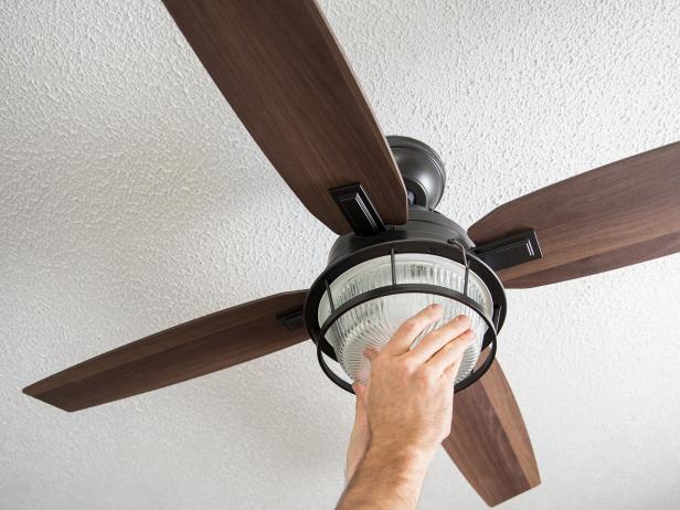 Finally, screw in light bulbs and install any globe or glass that’s included with your fan