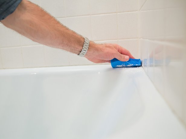 Finally, use the sponge to scrub away the baking soda and the soap scum along with it.