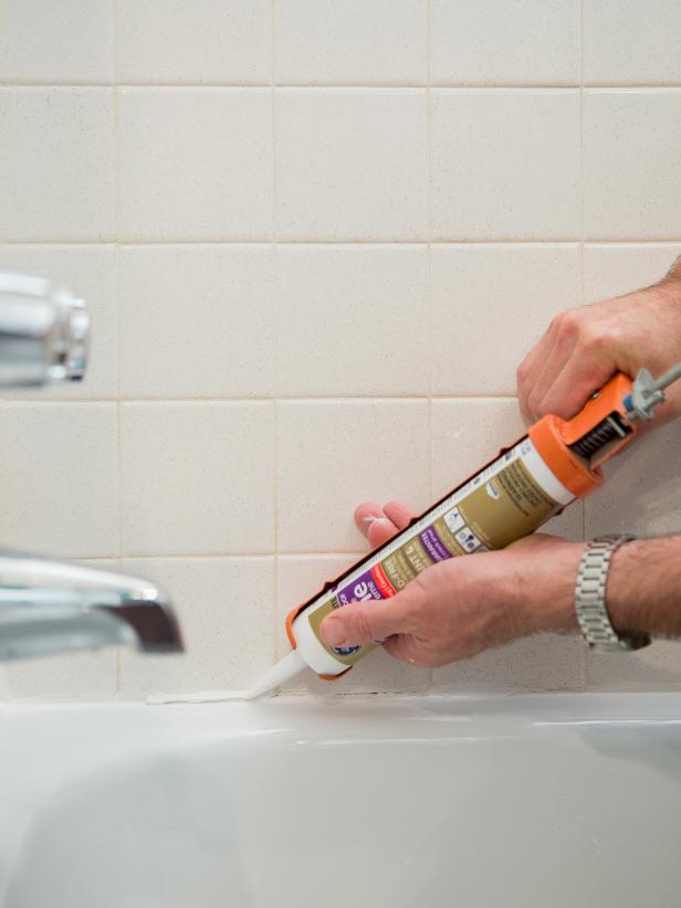 The simplest and most effective way to apply caulk is to lay a continuous thin line and then smooth it into place using a wet finger.