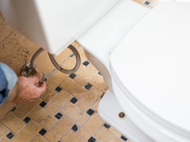 Before working on any plumbing project, be sure to turn off the water. The water supply line to your toilet is connected to the wall or floor; simply turn the valve to stem the flow of water.