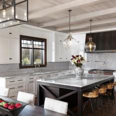 Gray and White Chef Kitchen With Glass Pendants