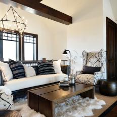 Rustic Black and White Sitting Area With Sheepskin