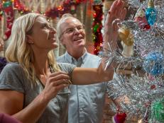 Left to Right: HGTV host Jasmine Roth and Mike Lookinland/Bobby during the reveal of the Holiday decorated Brady House family room, as seen on A Very Brady Holiday Special.