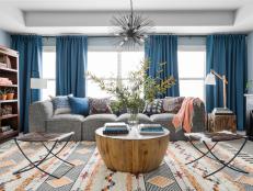 Inspired by the earthy orange tones, cool blues and warm grey-brown of the HGTV Dream Home 2020 great room, Kristen and Dwight's redesigned family room is now packed with practical storage solutions, plenty of seating, happy colors and a space plan that maximizes every square inch.