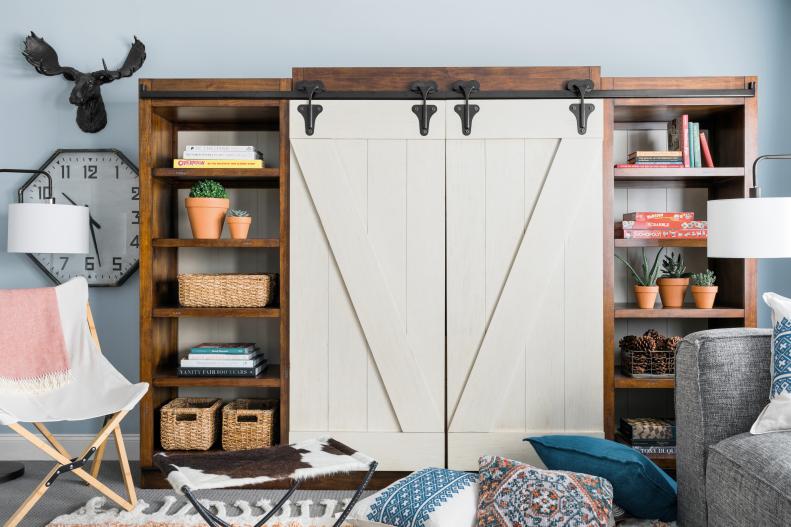 Staring at a reflective black rectangle is not ideal in a room meant for interaction. So, when the TV is not in use, this entertainment unit has barn doors which keep it hidden from sight.
