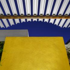 Bold Yellow Accent Wall and Pergola