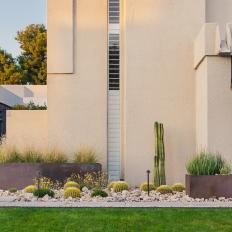 Modern Home with Cacti and Rock Bed Landscaping 