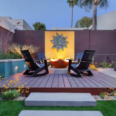 Raised Patio with Fire Pit and Bold Yellow Accent Wall 
