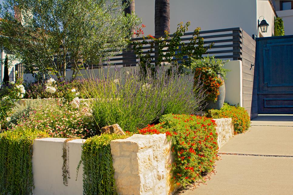 Stone Retaining Wall With Blooming Florals | HGTV