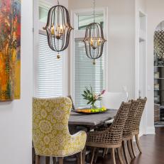 Dining Alcove With Artistic Chandeliers, Colorful Dining Chairs