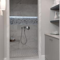 Walk-In Shower With Gray Floral Pattern