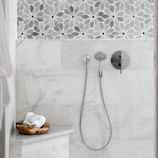 Gray Walk-In Shower With Tile Flowers