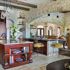 Mediterranean Open Plan Kitchen With Stone Wall
