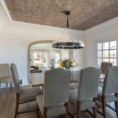 Mediterranean Dining Room With Brick Ceiling