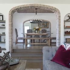 Living Room and Dining Room With Brick Arch