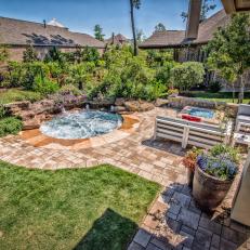 Backyard With Hot Tub and Lawn